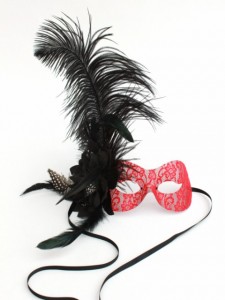 Red lace burlesque mask with large black ostrich feather and a feather flower
