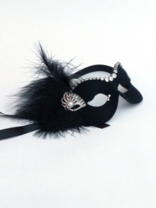 Black mask decorated with black feathers and vintage art deco diamante jewellery